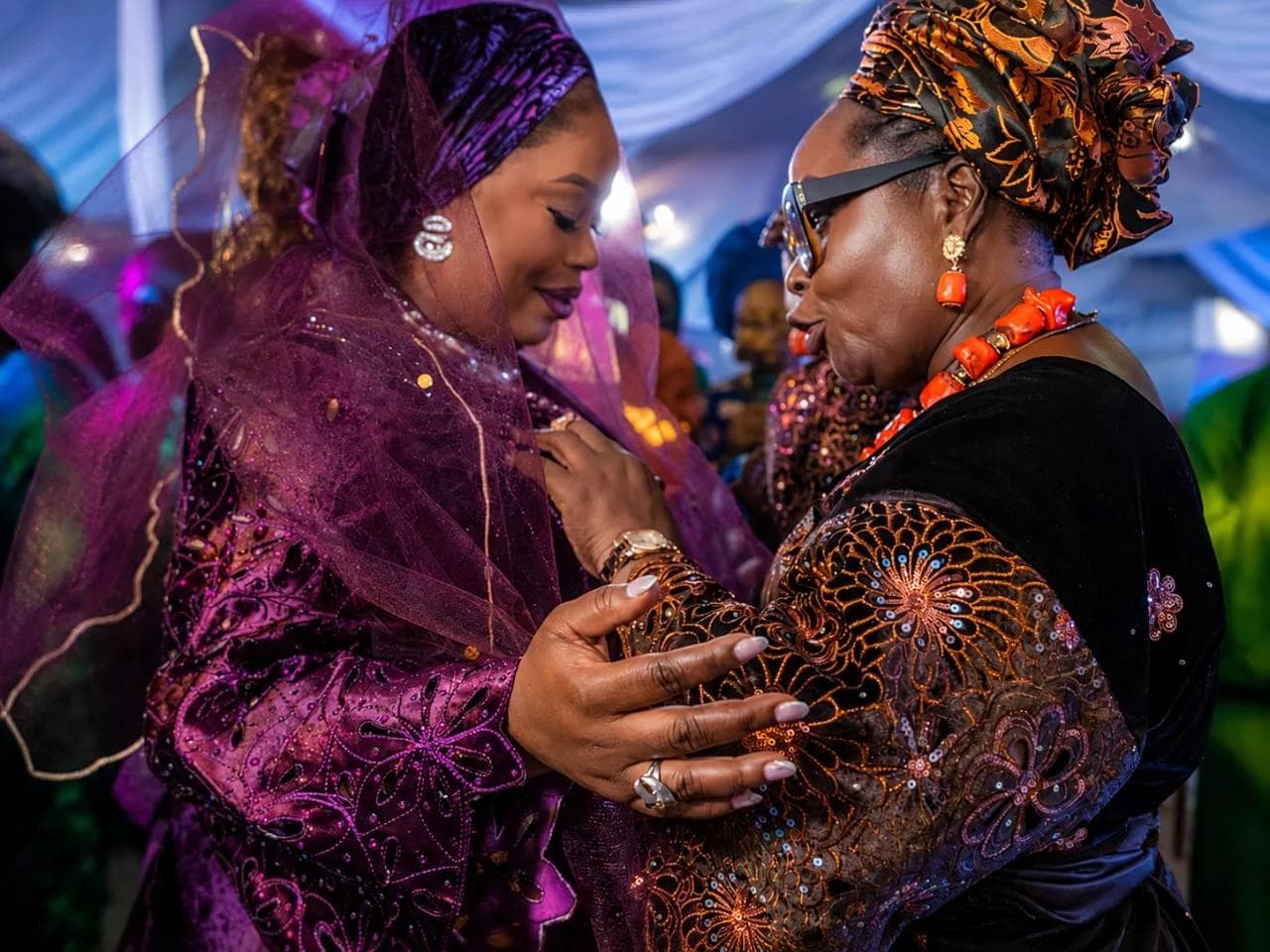 A couple embracing during the wedding celebration.